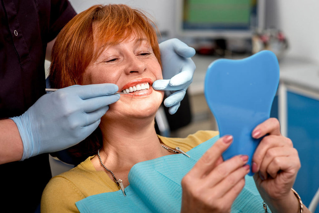 Senior woman in the dental office